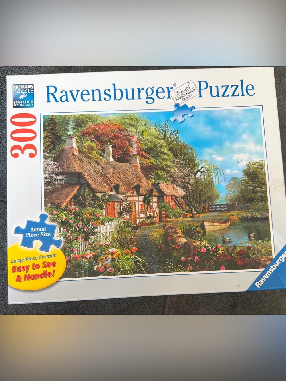 Ravensburger Blue-Cottage on a Lake Garden Puzzle with Bright Floral Colors
